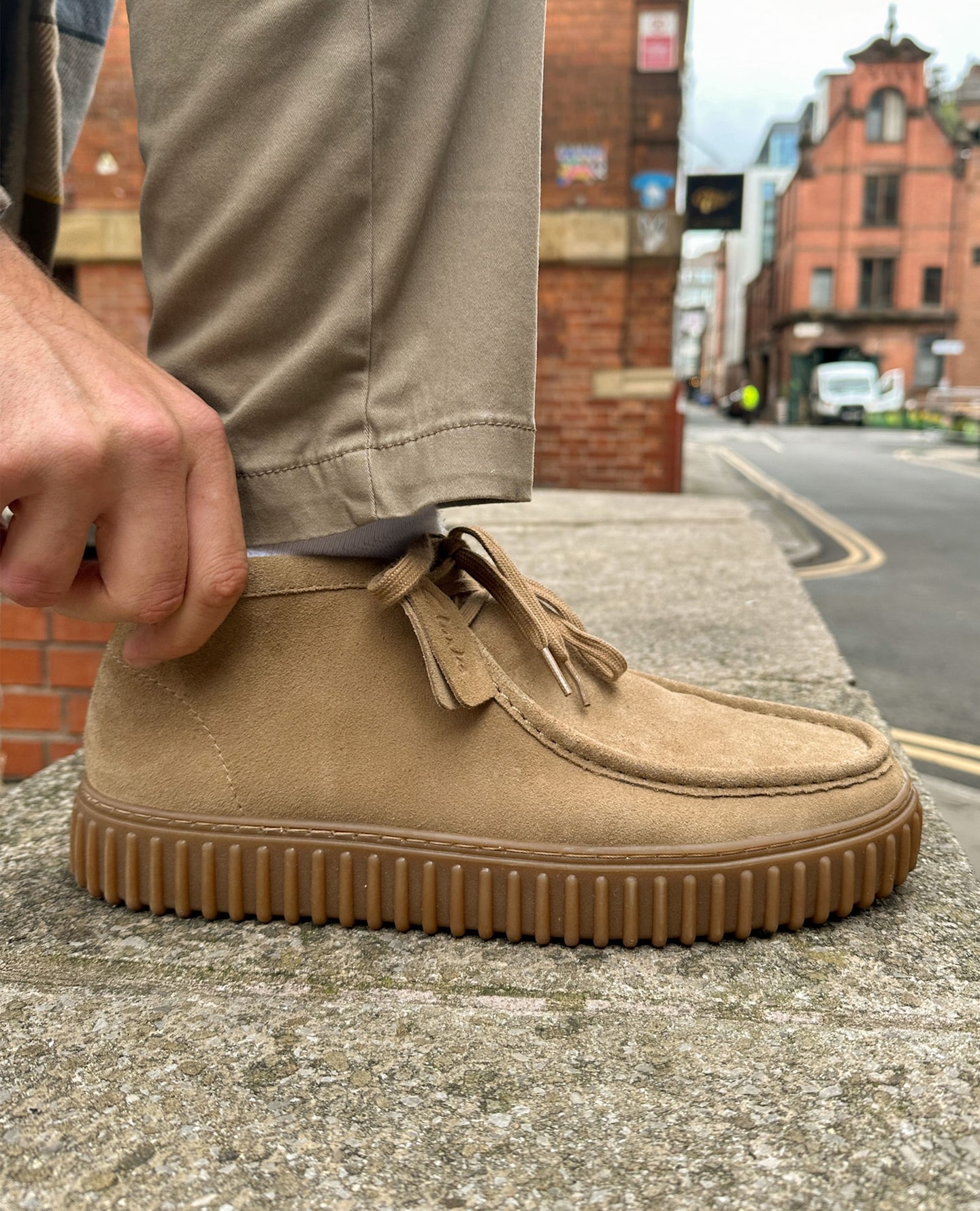 Model wears Clarks Suede Torhill Boot
