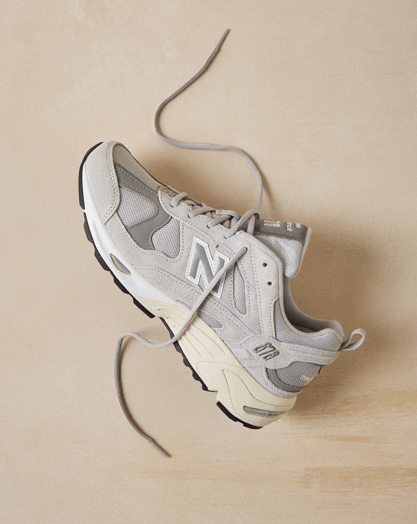 A pair of grey New Balance 878 trainers