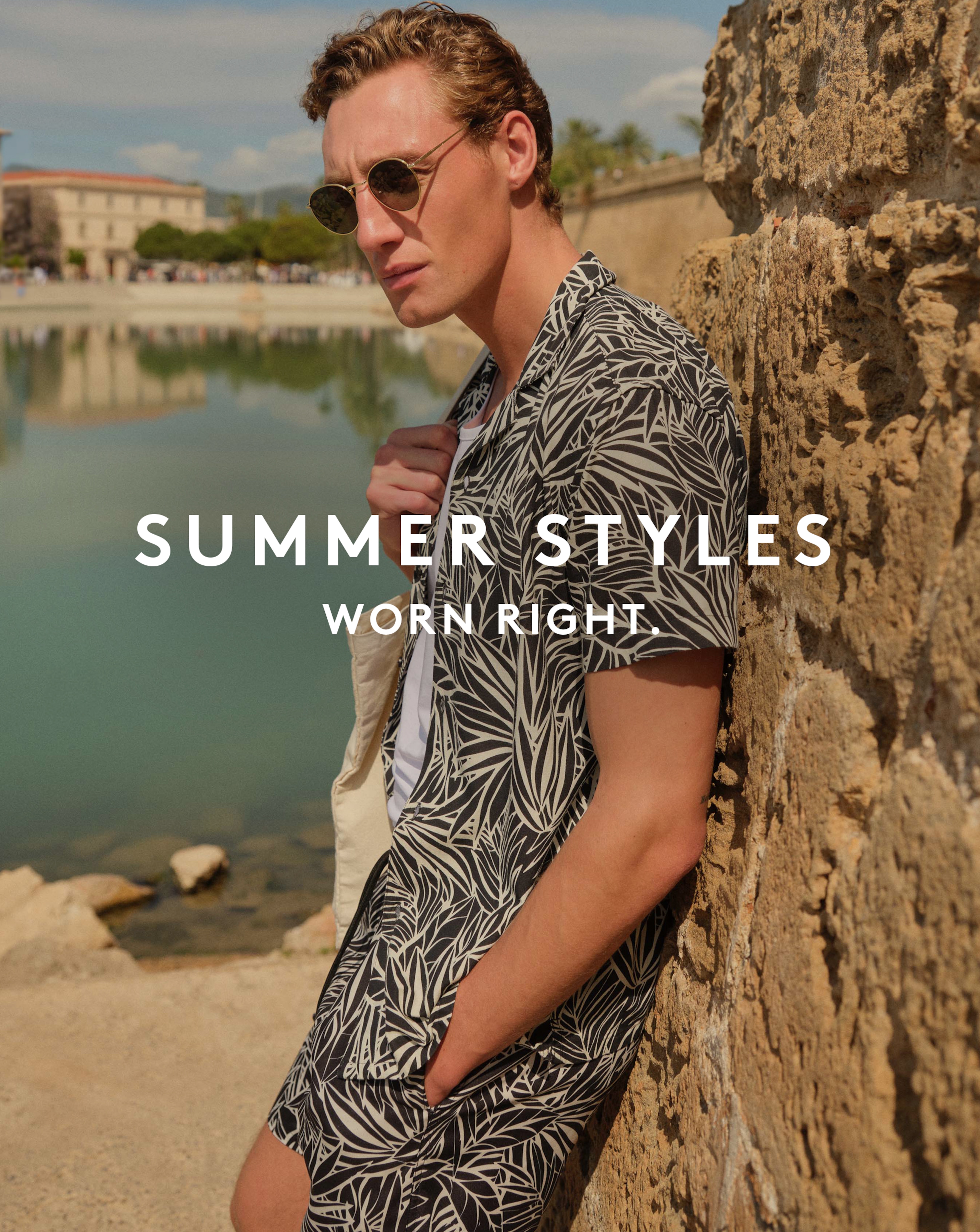 Summer styles worn right. Model wears Mono Palm Print Revere Collar Shirt.