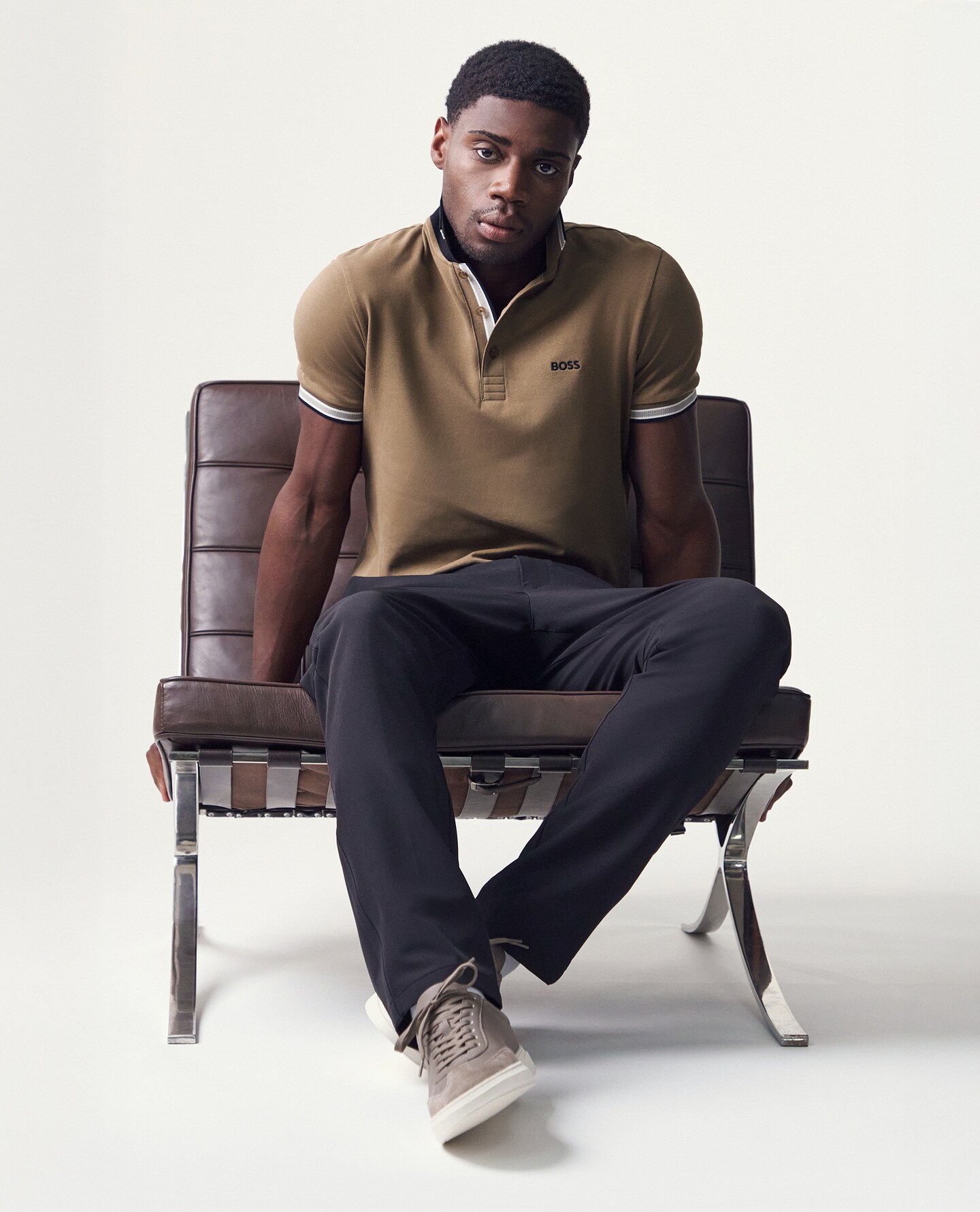 Model wears BOSS Classic Short Sleeve Paddy Polo in Brown