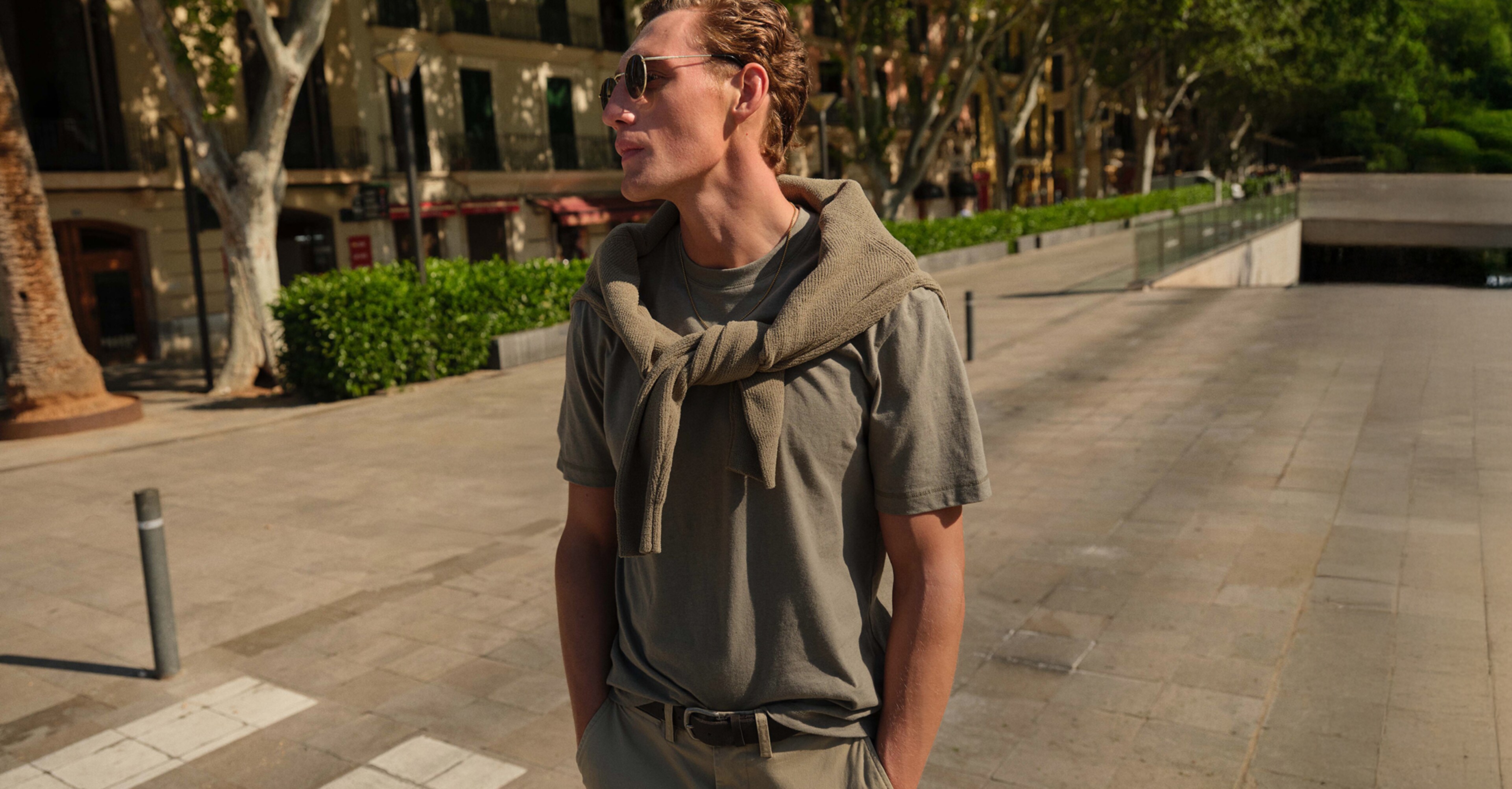 Model wears Linen Blend Relaxed Fit T-Shirt with Folio Cotton Stretch Jogger and jumper in khaki