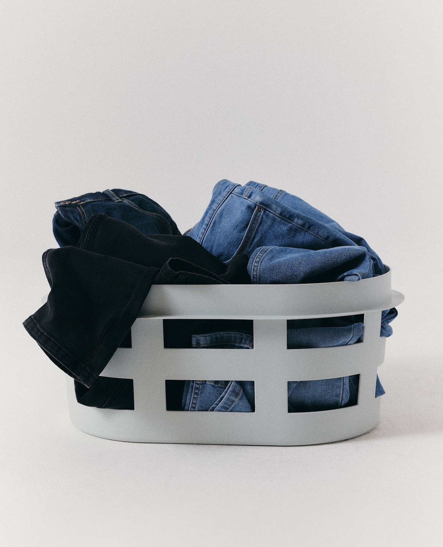 Jeans arranged in a wash basket