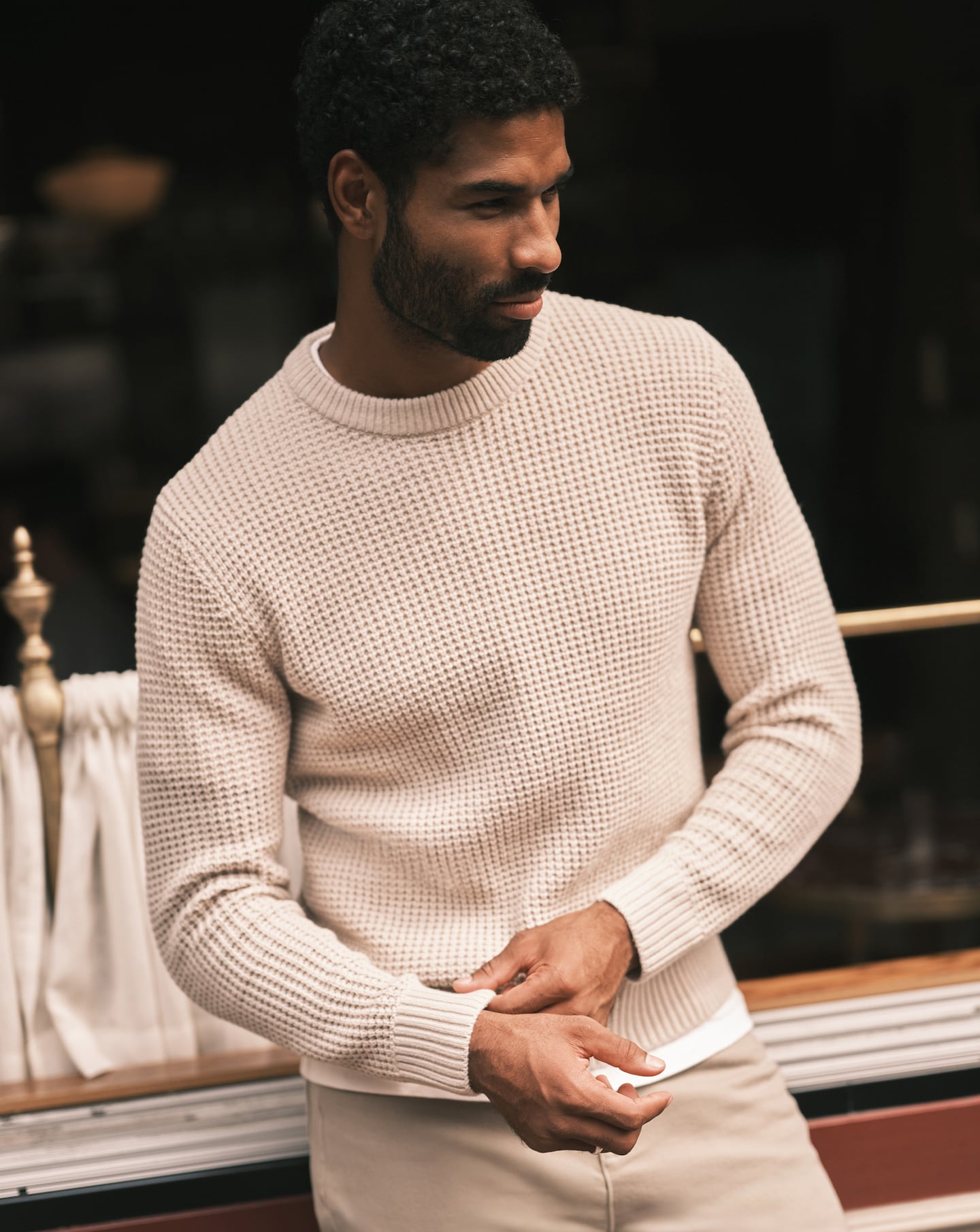 Model wearing a cream knitted jumper