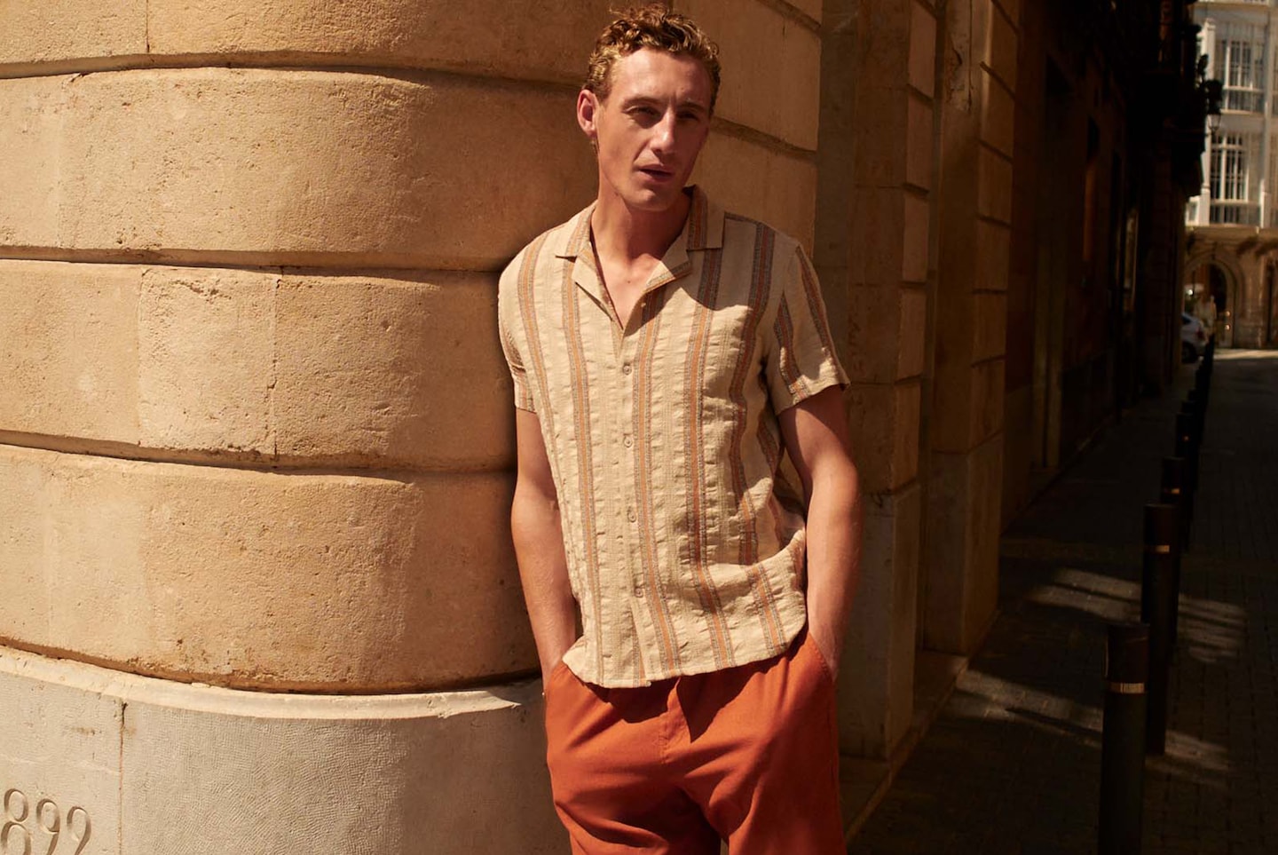 Model wears Reg Length Pointelle Revere Collar Shirt