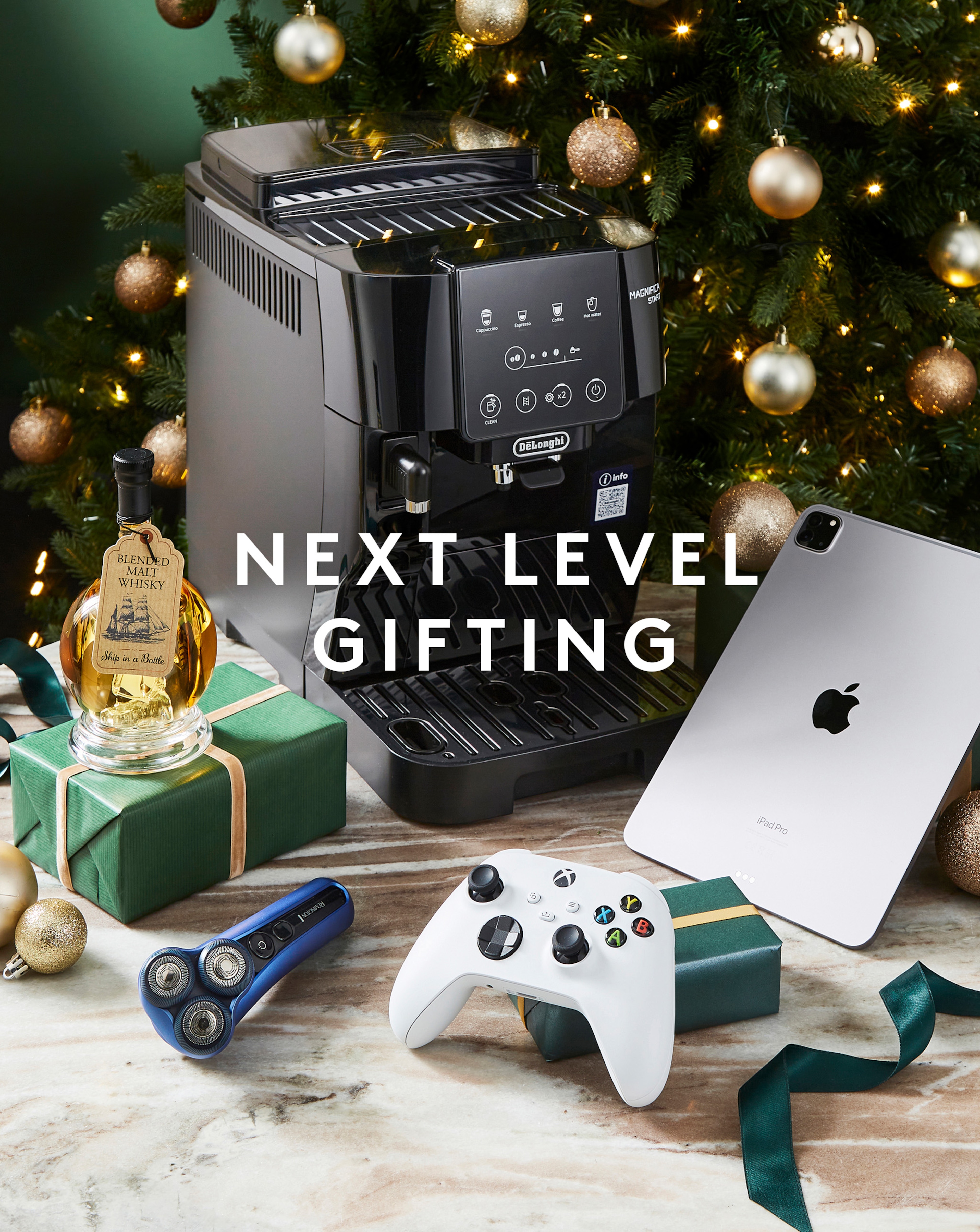 Christmas gifting scene that includes an Xbox console, iPad and coffee machine