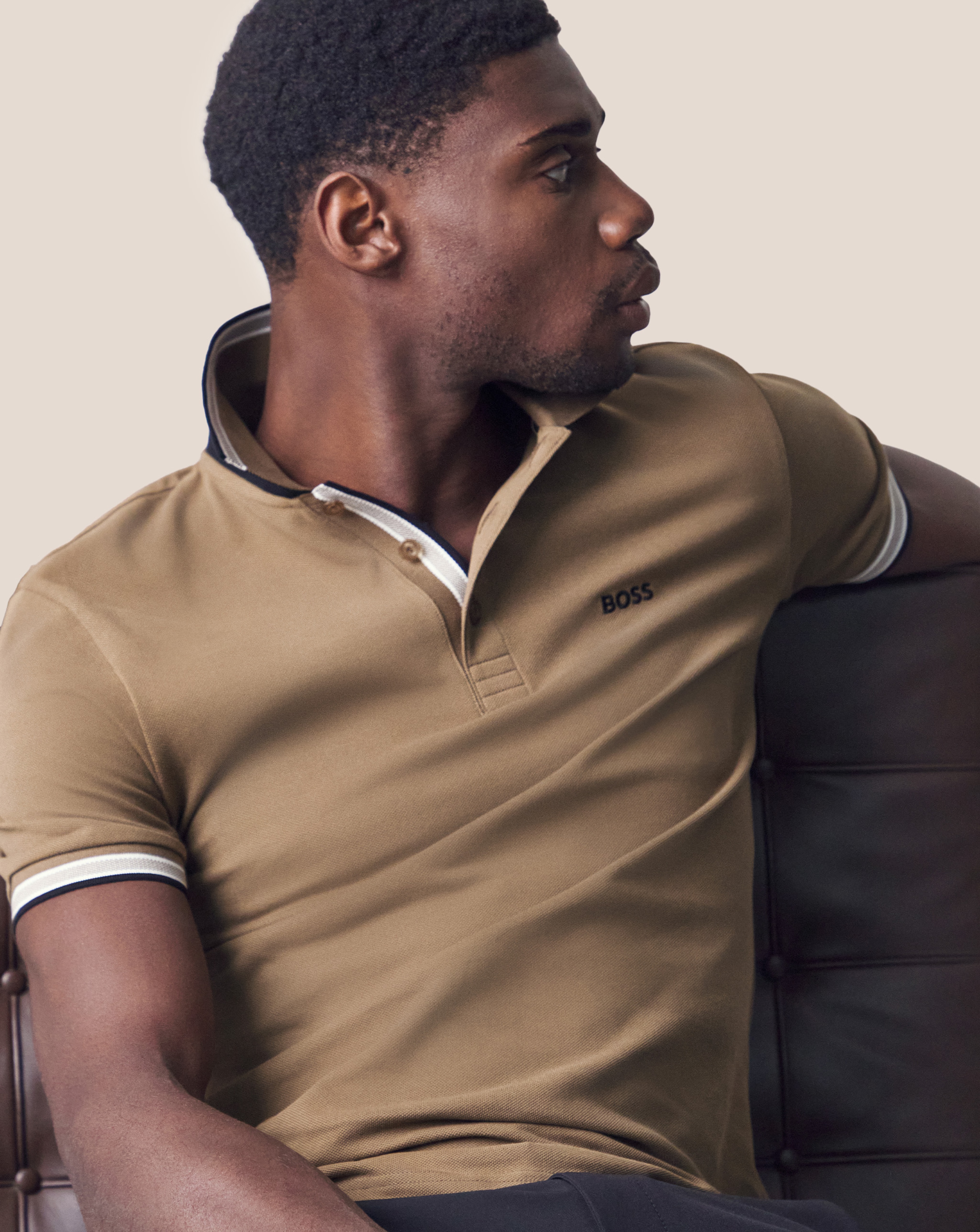 Model wearing a beige BOSS polo