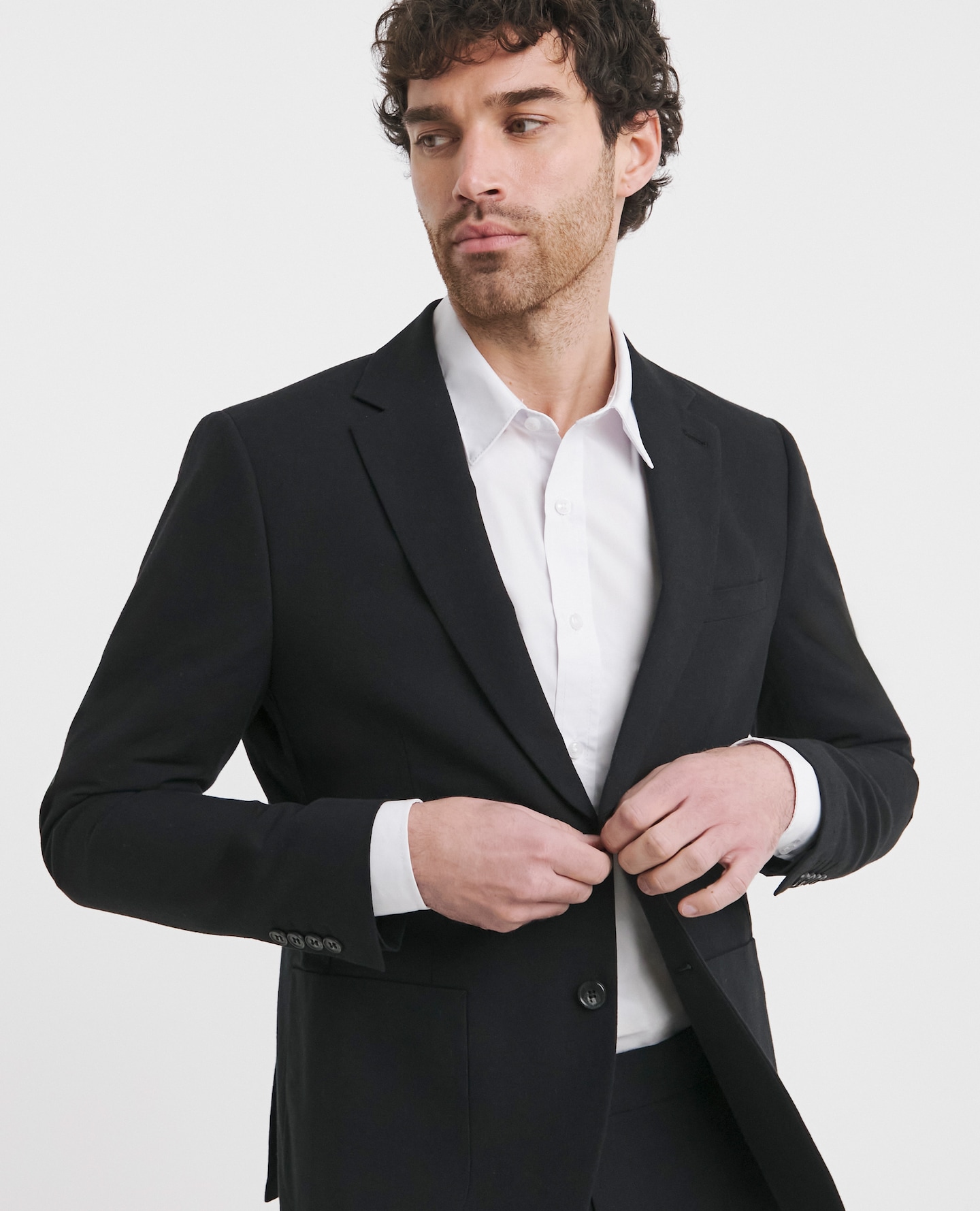 Model wearing white shirt and black blazer