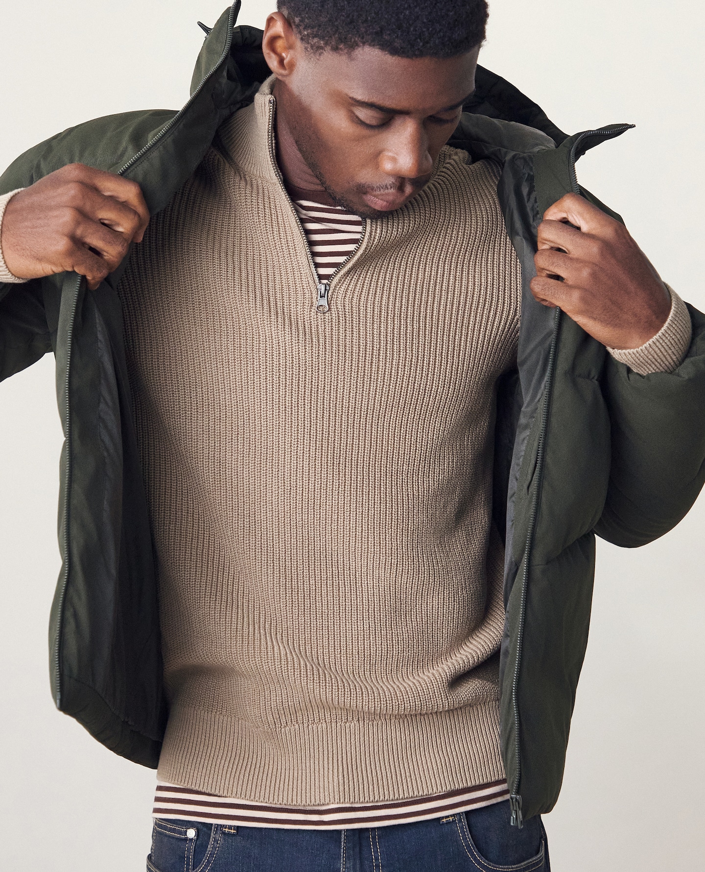 Model wears Jack & Jones Global Puffer Coat - Green with Fisherman 1/4 Zip Knitted Jumper - Stone 
