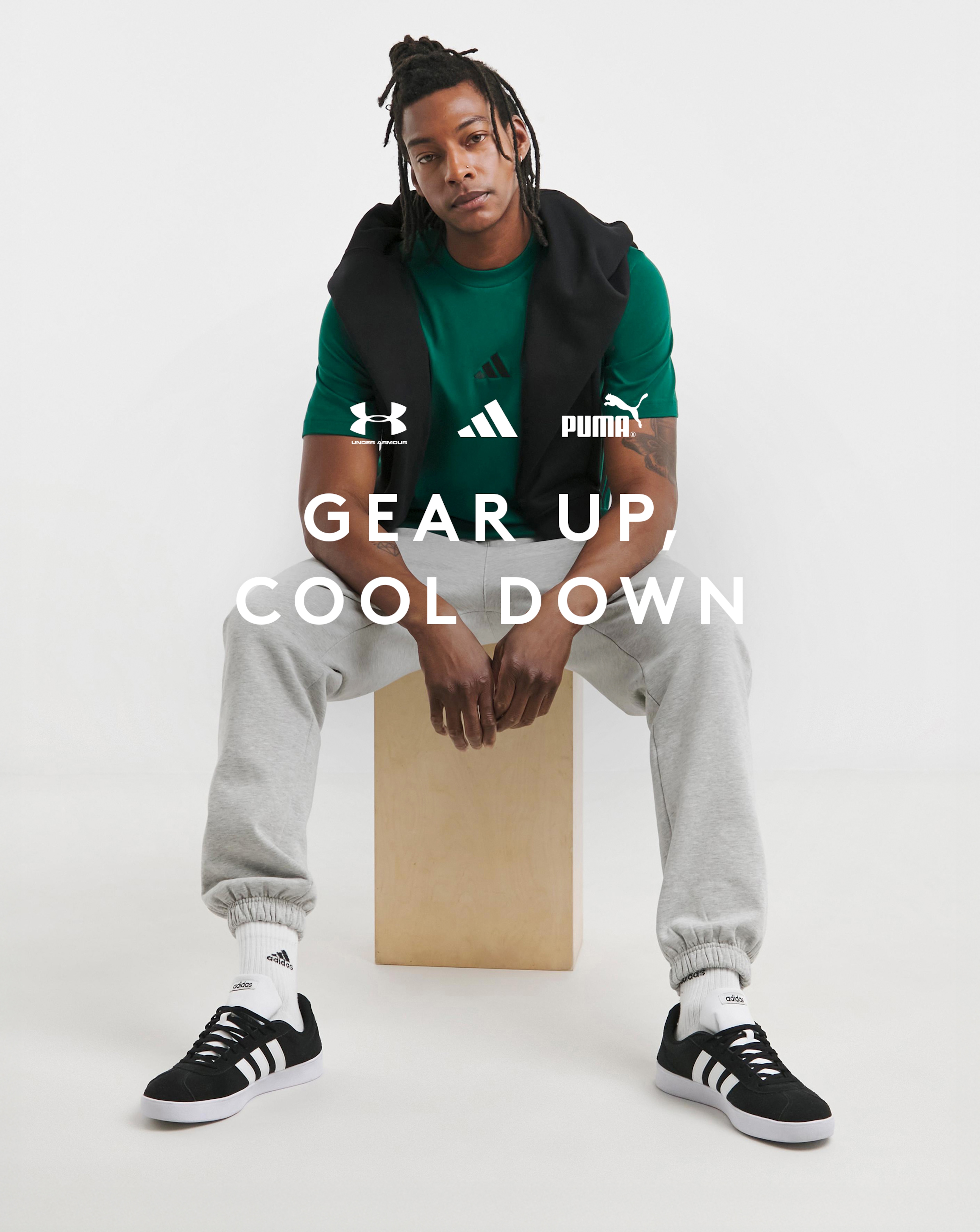 Model wears adidas 3 Stripes T-Shirt with grey joggers and adidas VL Court 3.0 Trainers