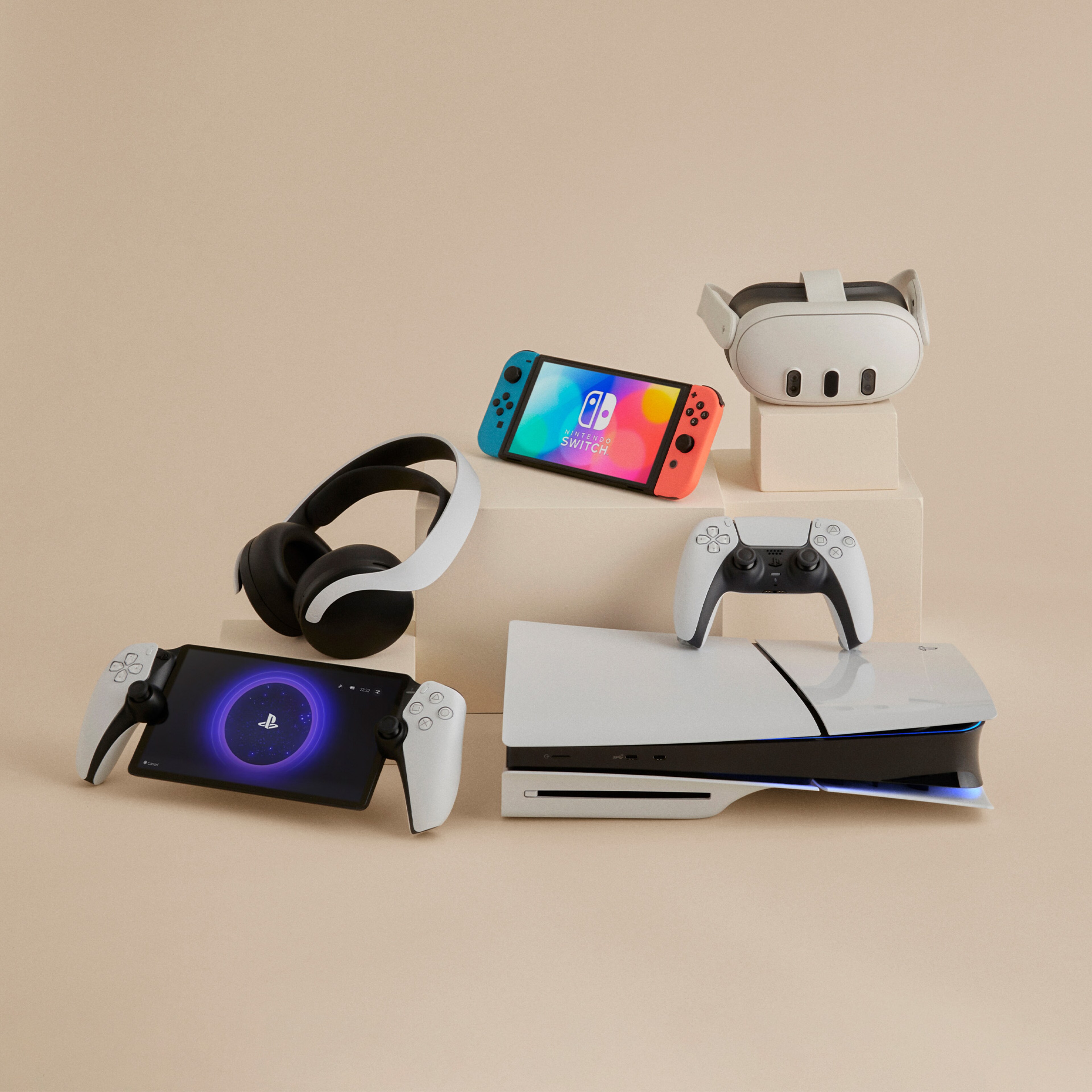 Layout of technology including Playstation 5, Nintendo Switch and headphones