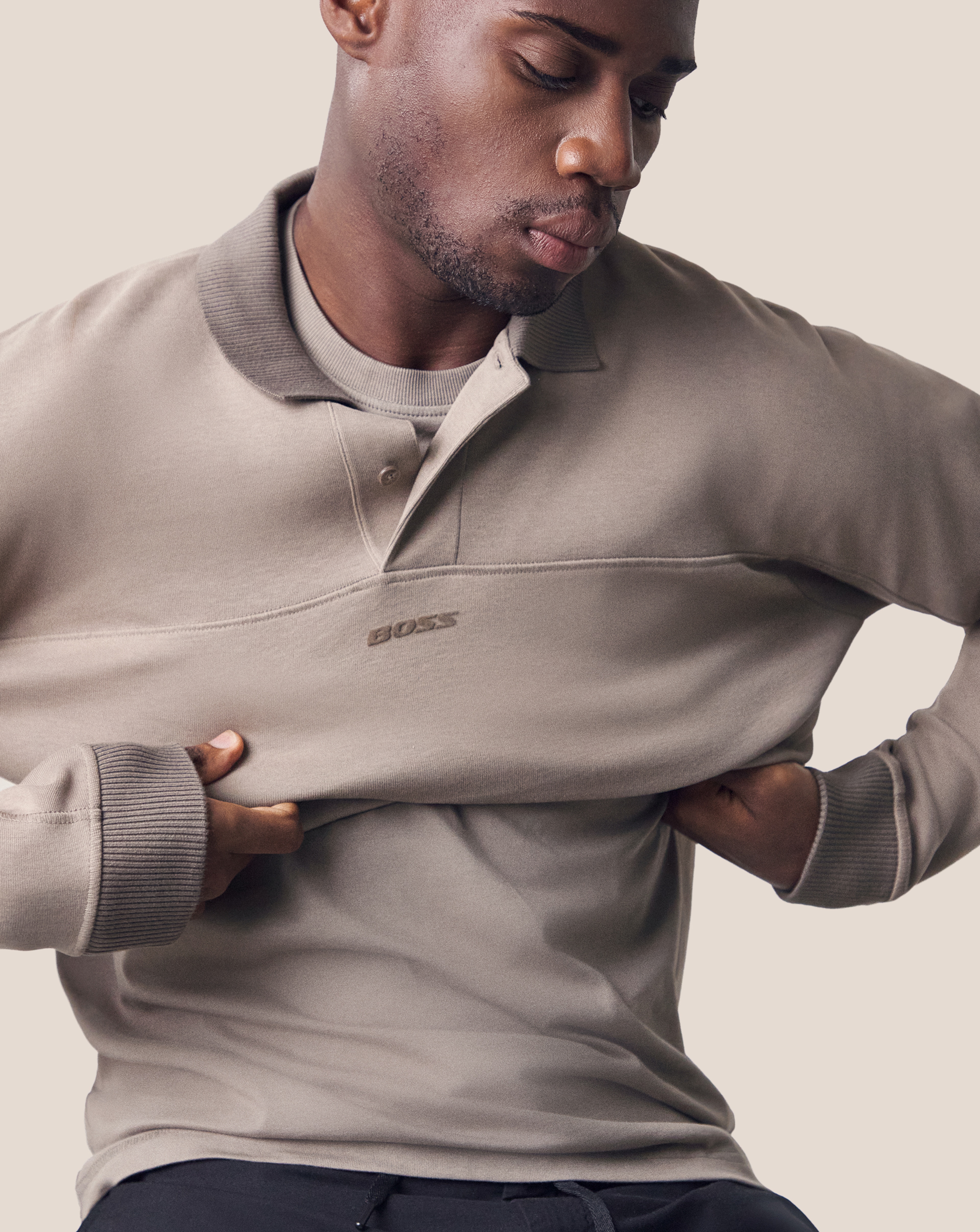 Model wears BOSS Long Sleeve Relax Fit Polo - Beige