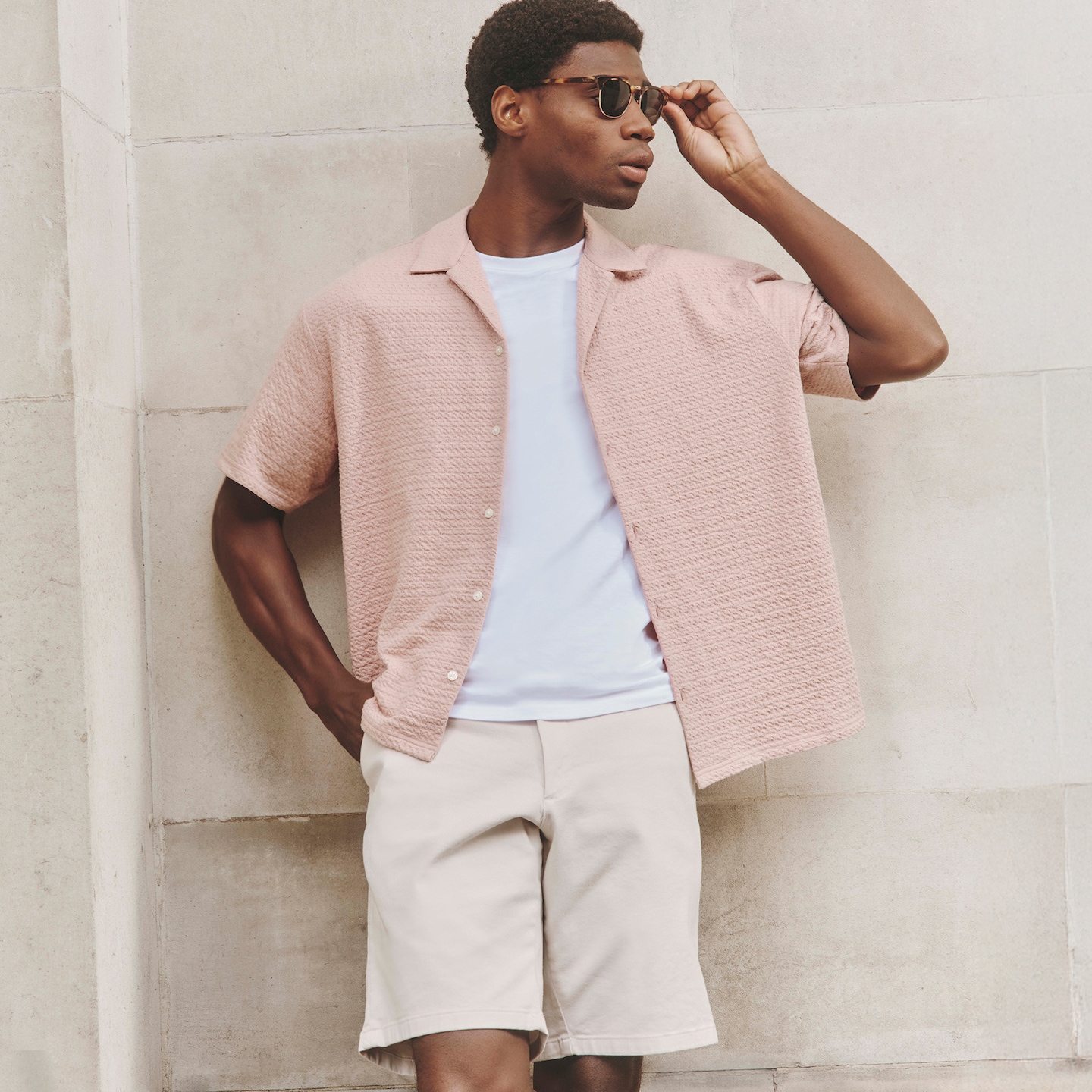 Model wears Jack & Jones Premium Blaleo Textured Resort Shirt - Pink with White t-shirt and Union Gabardine Stretch Short