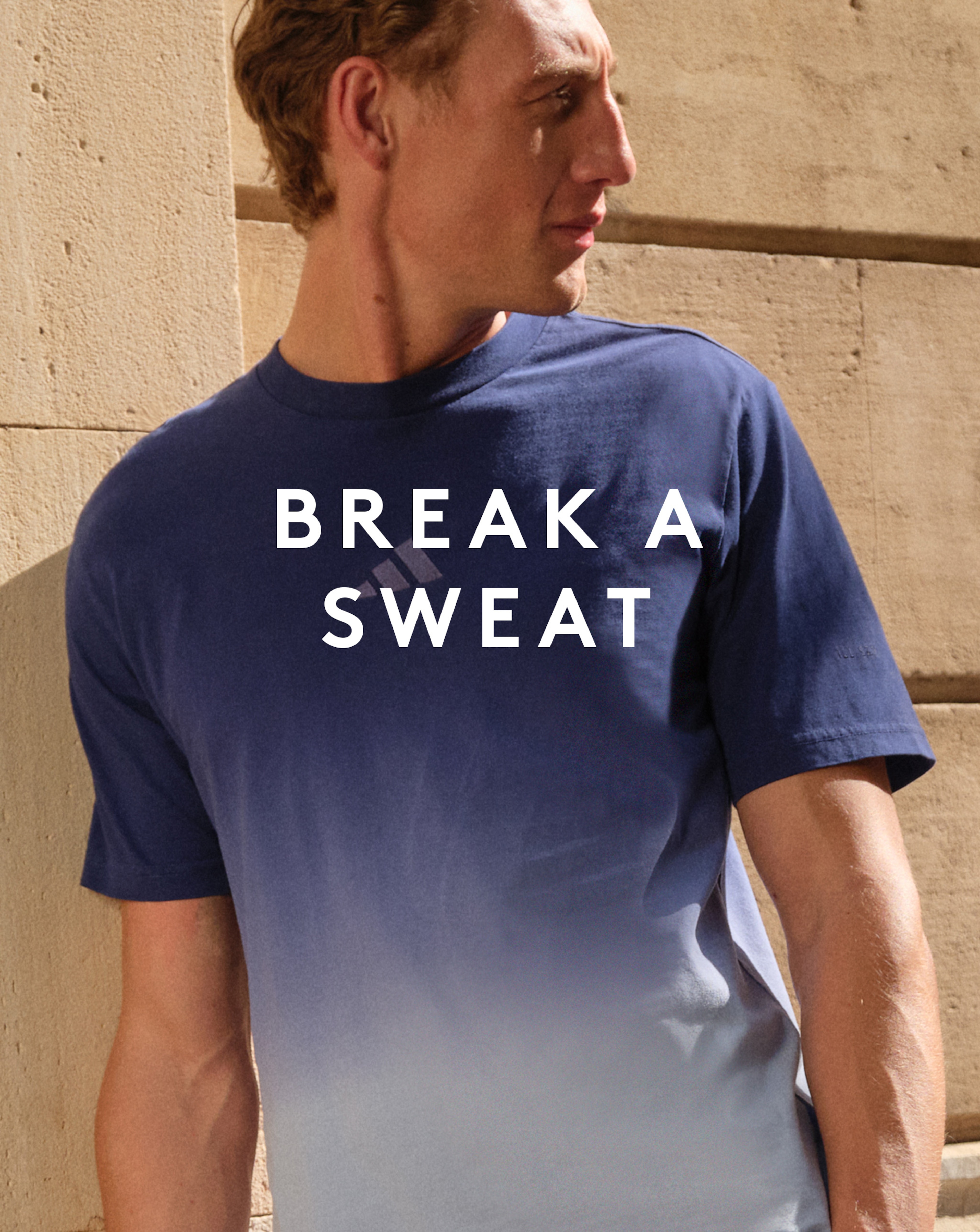 Model wearing blue adidas t-shirt
