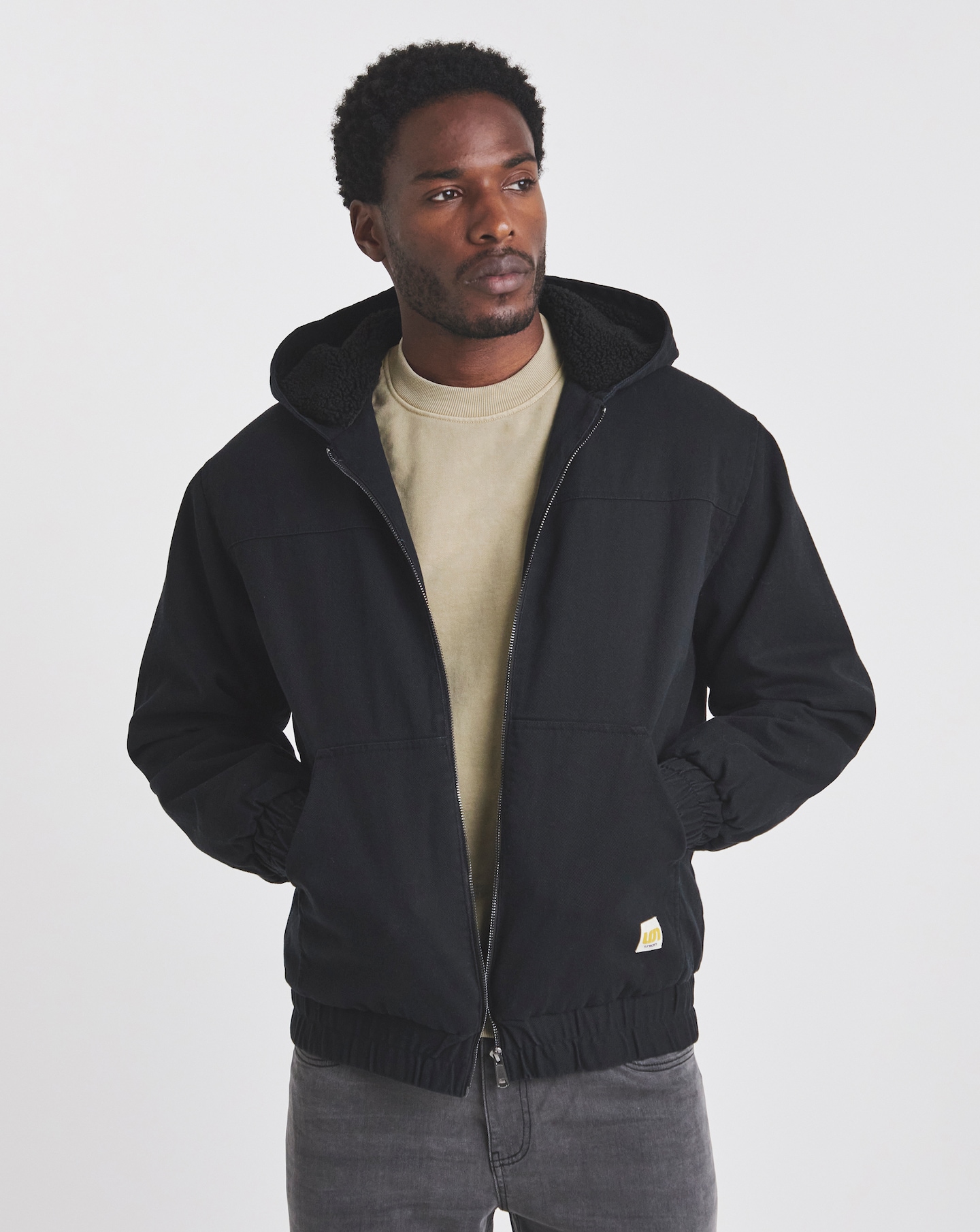 A man wearing a black Union borg lined jacket