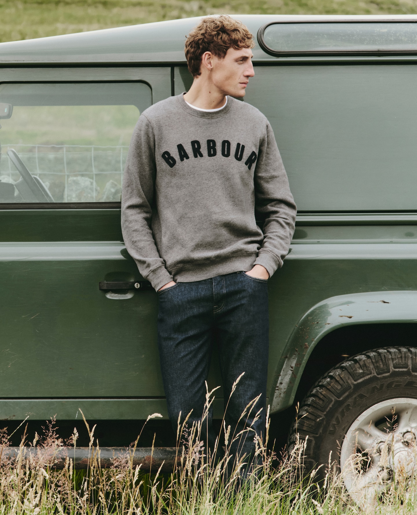 Model wears Barbour Prep Logo Crew Neck Sweatshirt - Grey Marl