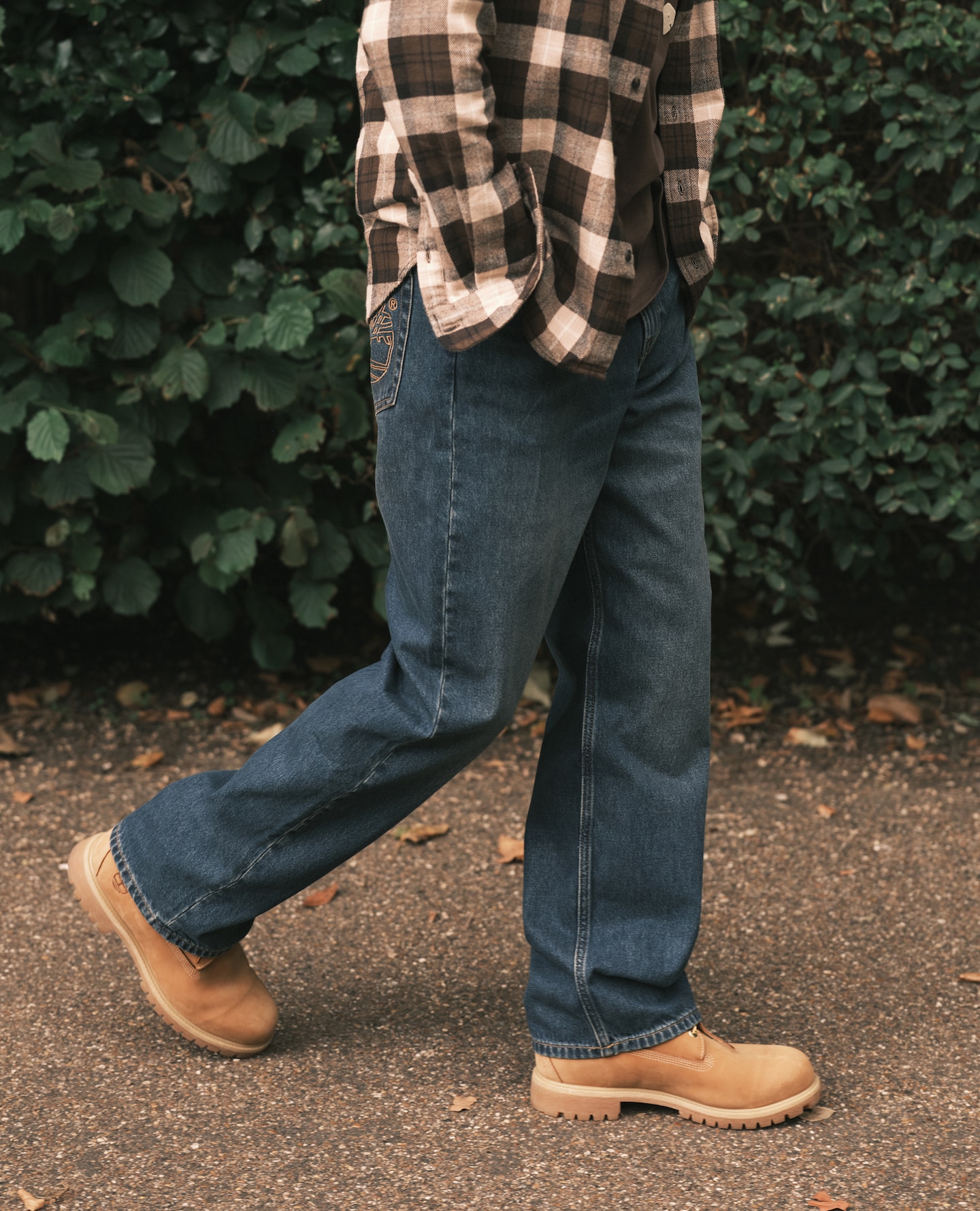 Model wears Timberland Sandown Pocket Embroide Tree Logo Denim Jeans - Blue with Timberland Premium 6 Inch Waterproof Boot - Wheat