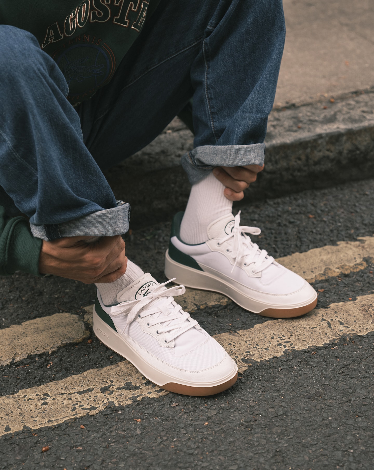 Model wears Lacoste Men's G80 Club Textile Popped Heel Trainers