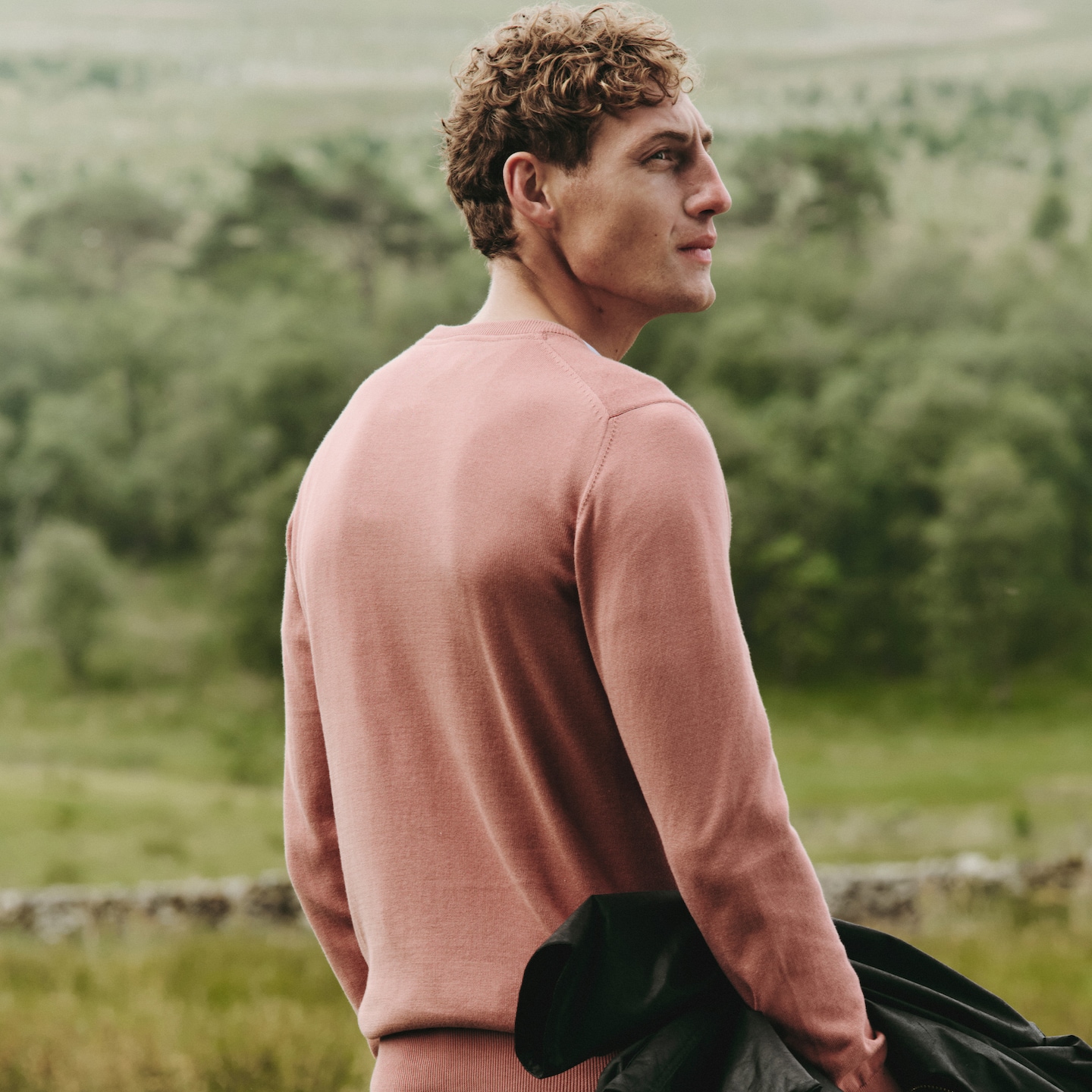 Model wearing pink Barbour knit
