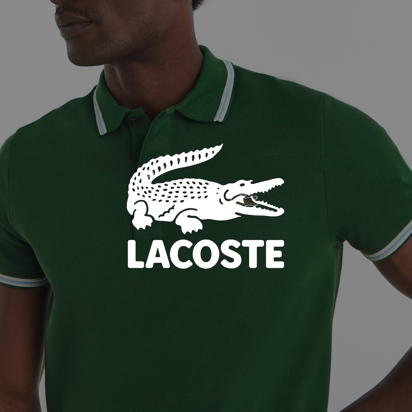 Lacoste. Model wears Lacoste Short Sleeve Tipped Polo - Dark Green