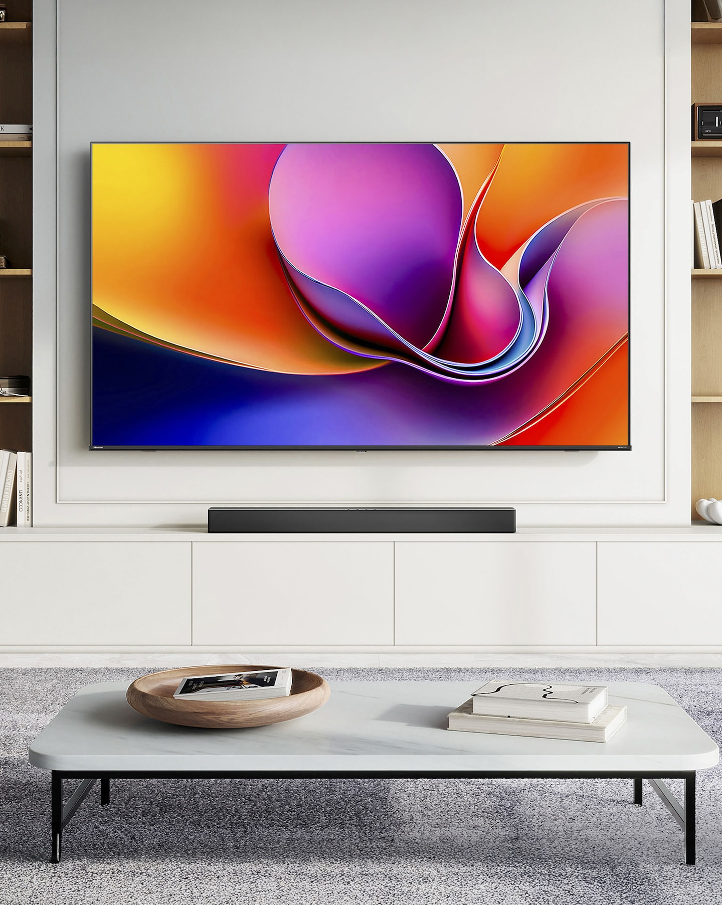 A TV with a colourful pattered image on a wall