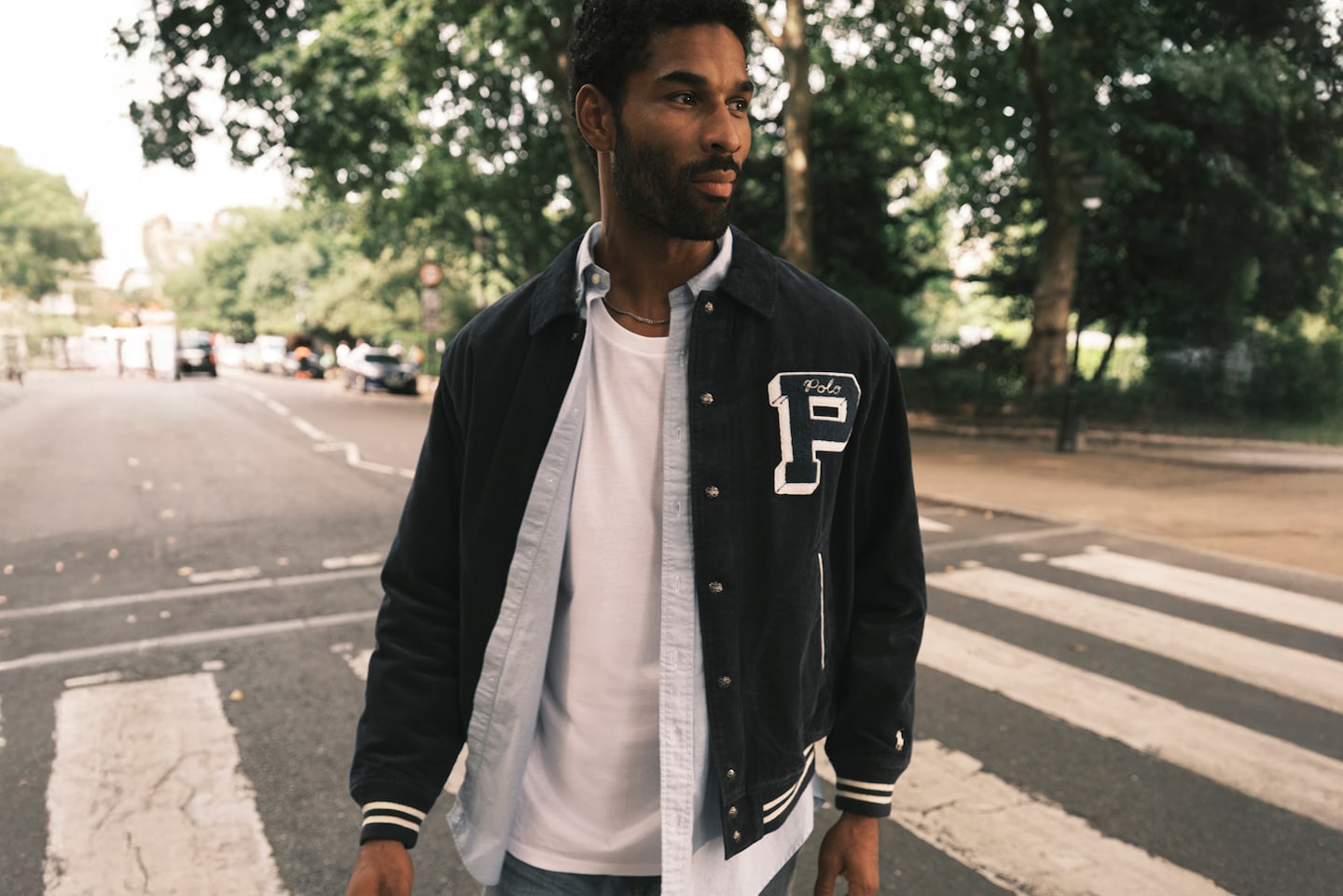 Model wears Polo Ralph Lauren Cord Varsity Jacket - Navy