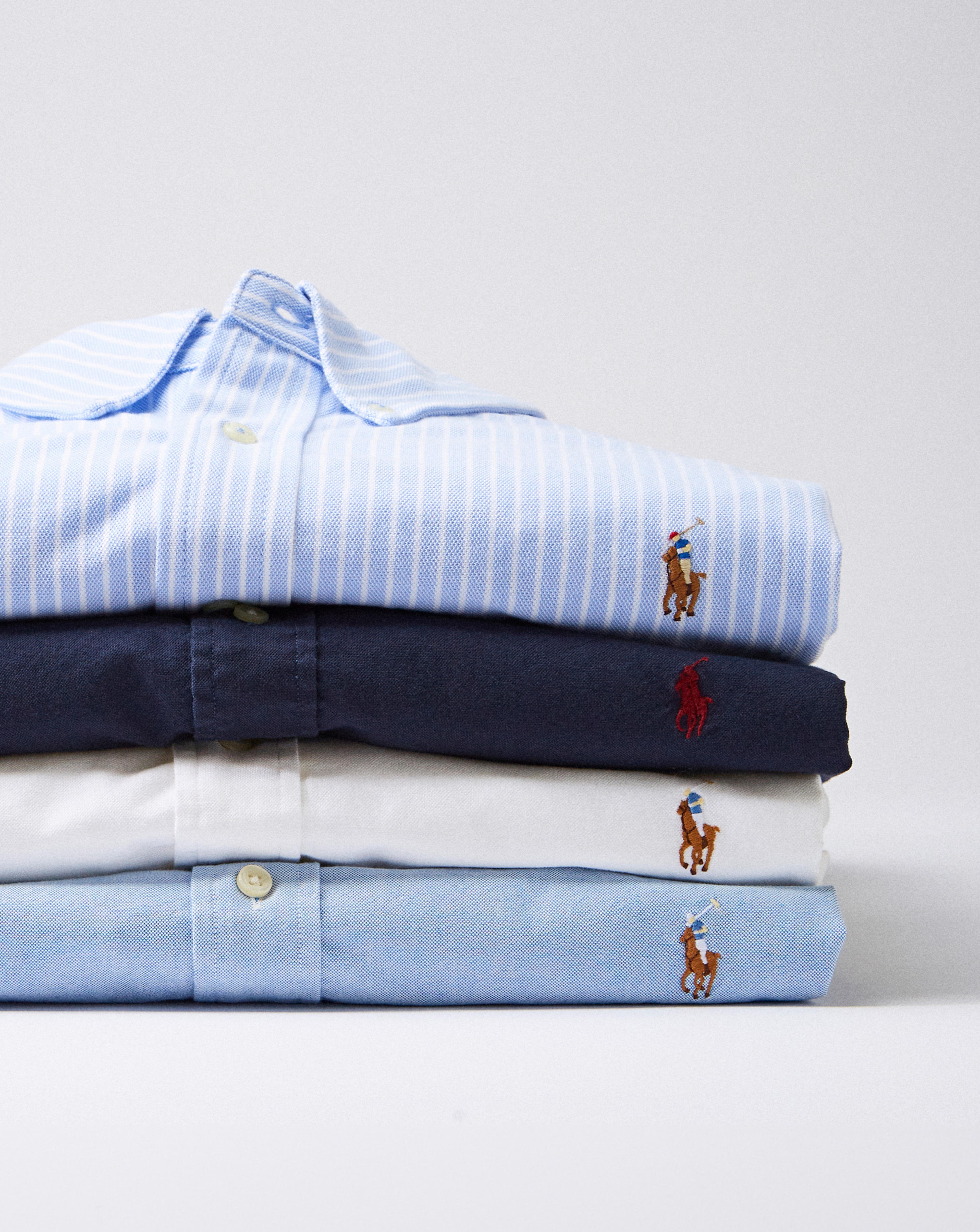 Stack of blue Polo Ralph Lauren shirts