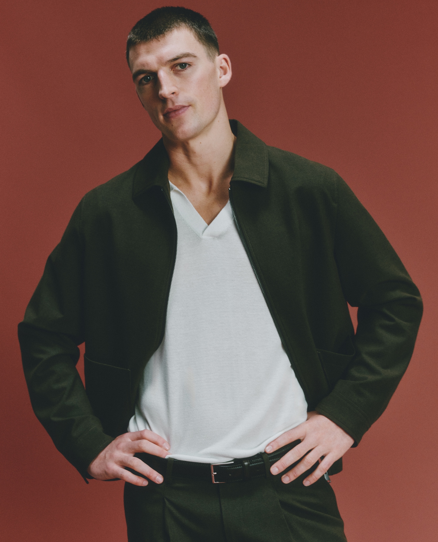 Model wears Tailored Zip Through Harrington Jacket and matching Trousers with white polo top