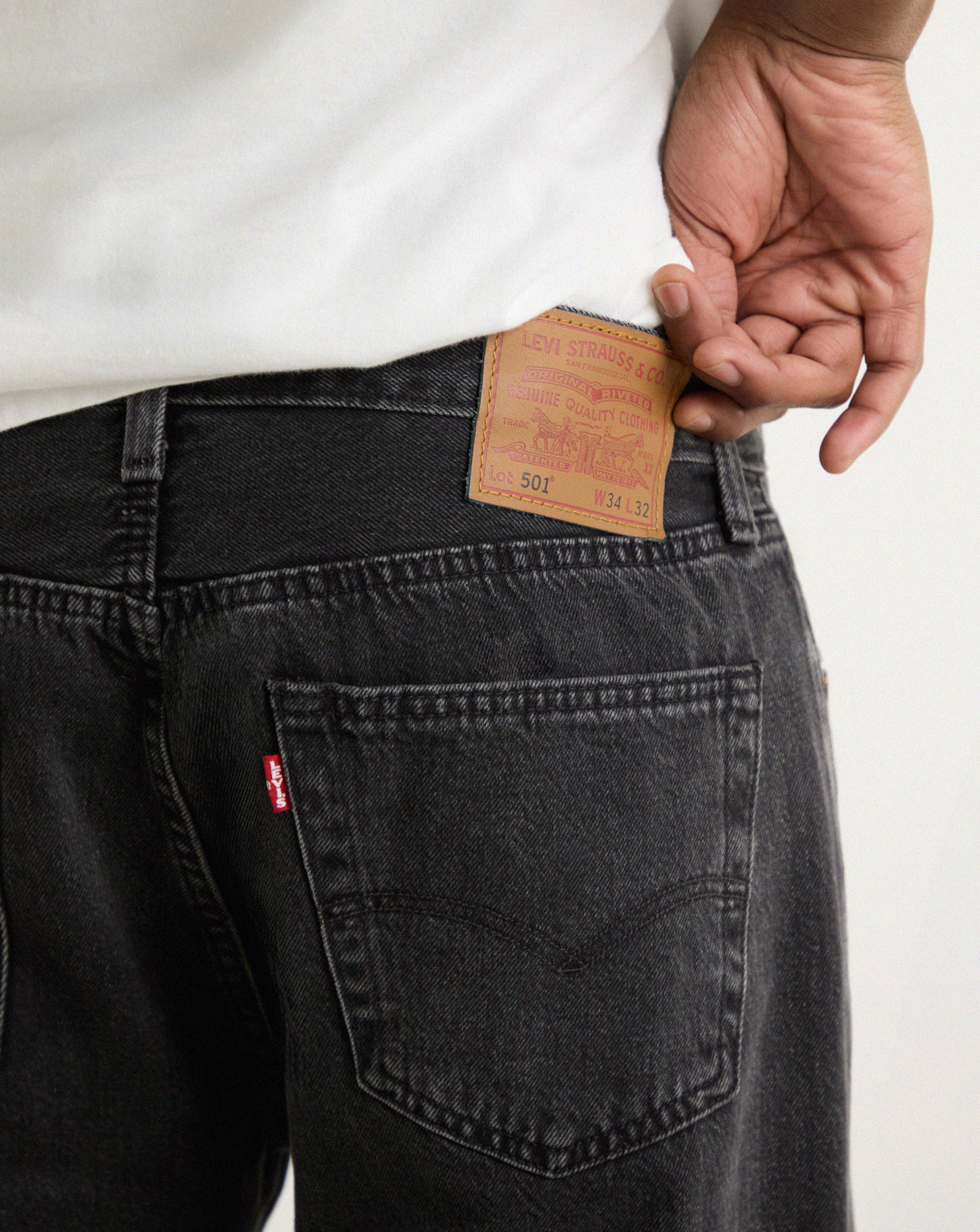 Model wears Levi's 501 Original Straight Fit Jean - Worn Black