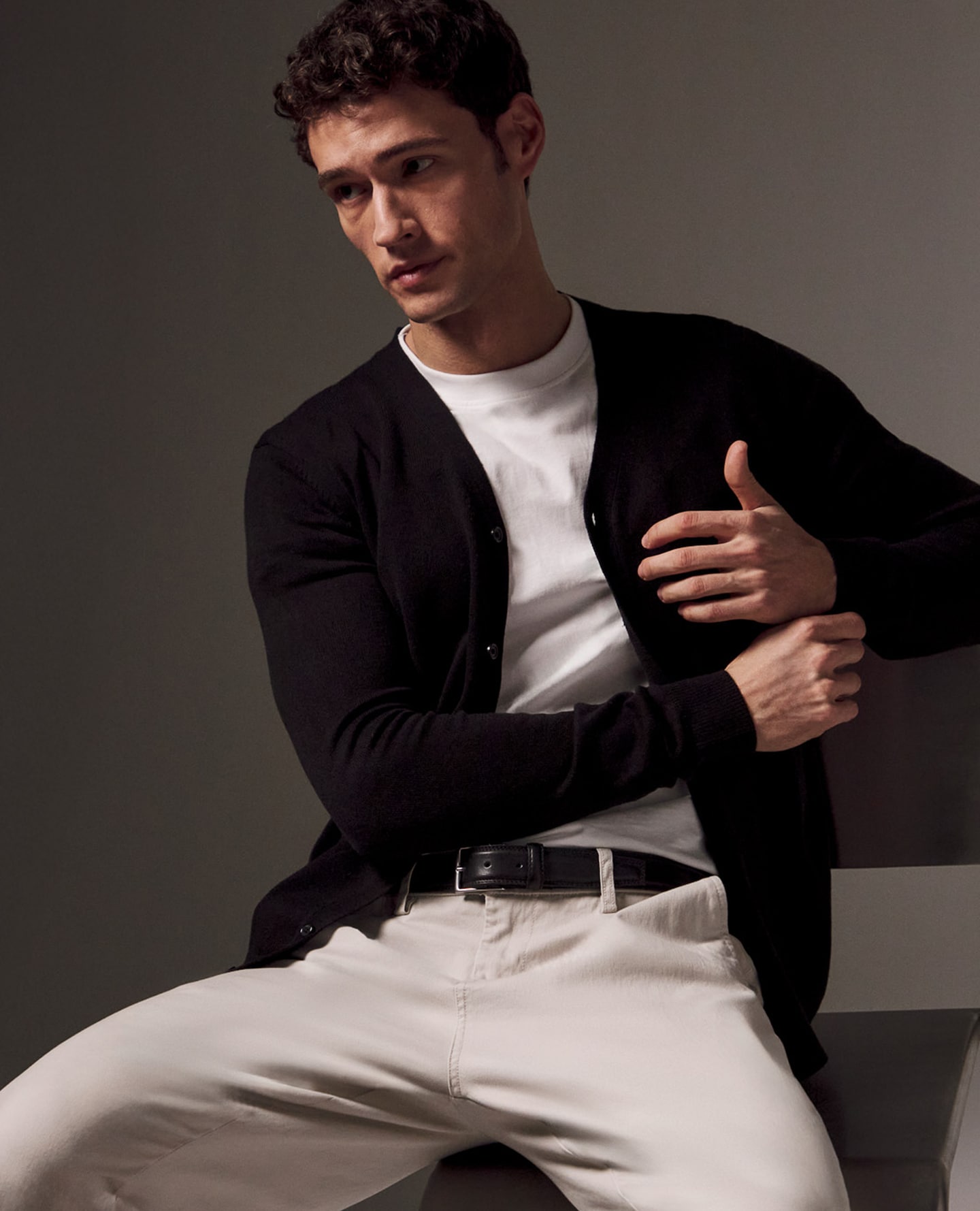 Model wears Value Knitted Cardigan with white tee and Cream Chinos